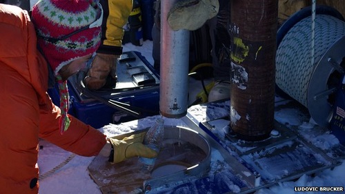 Photo of Greenland researchers drilling