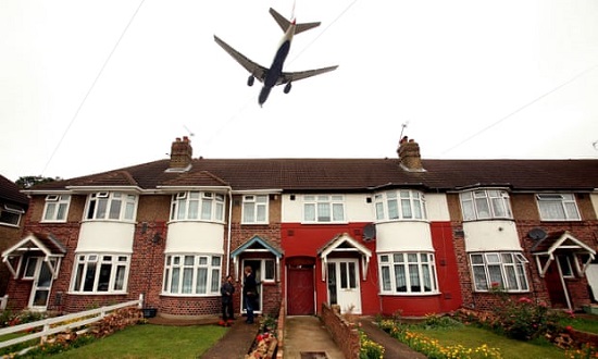 Jet over row houses in UK