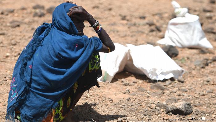 Woman waiting for food distribution in Kenya